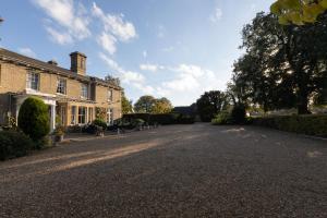 an empty driveway in front of a house at Slepe Hall Hotel in St Ives