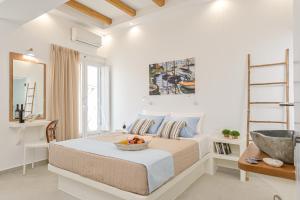 Ein Bett oder Betten in einem Zimmer der Unterkunft Elite Suites Naxos