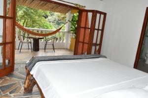 Ліжко або ліжка в номері Eco Hostal Kuima +37 фото
