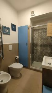 a bathroom with a toilet and a shower and a sink at Casa Vacanze Gloria in Castellammare del Golfo