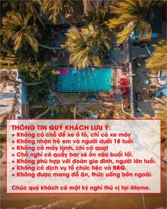 uma placa com uma imagem de uma piscina com palmeiras em iHome Backpacker Resort em Mui Ne