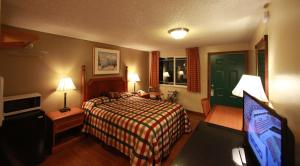 Postel nebo postele na pokoji v ubytování Executive Motel + 5 fotografií