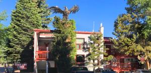 a building with an eagle statue on top of it at Tyrolean Lodge in Aspen