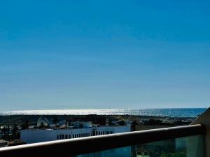 a view of the ocean from the balcony of a building at OceanParc - Vue sur Mer et Parc 24H Sécurité in Mohammedia