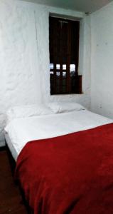 Łóżko lub łóżka w pokoju w obiekcie Finca Campestre Rancho Alegre