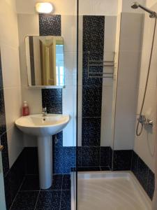 a bathroom with a sink and a shower at Pelagos in Stafylos