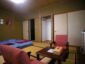 Postel nebo postele na pokoji v ubytování B&B Koyuki Hakuba