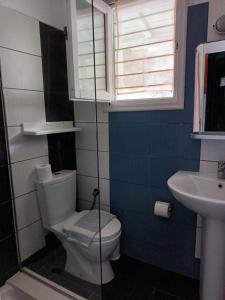 a bathroom with a toilet and a sink at Pelagos in Stafylos