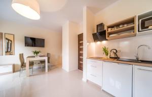 Fotografie z fotogalerie ubytování Gray House Apartamenty Dziwnówek v destinaci Dziwnówek