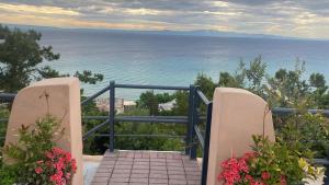 a stairway with a view of the ocean at Elena apartment chalkidiki in Kallithea Halkidikis