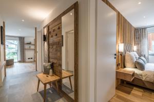 Postel nebo postele na pokoji v ubytování Dorf Suites
