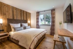 Postel nebo postele na pokoji v ubytování Dorf Suites
