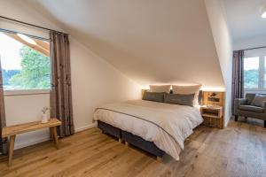 Postel nebo postele na pokoji v ubytování Dorf Suites