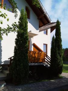 a house with a bike parked in front of it at Casa Lacul Mierlei in Sovata +29 photos