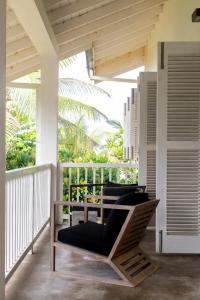 a porch with chairs on a balcony at Arabella on Boossa in Galle