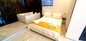 Postel nebo postele na pokoji v ubytování Ercolano Luxury Suite