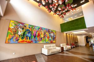 a lobby with a large painting on the wall at Chulia Mansion in George Town