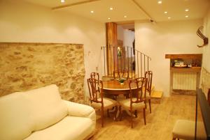 a living room with a table and a couch at Cal Sabater in Preixana