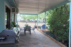 a patio with a table and chairs and a grill at Stay and Relax in Barmera