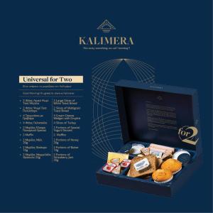 a box of kleinnerner donuts on a blue background at Amalia in Paleo Tsifliki
