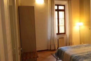 A bed or beds in a room at CasaLonghi