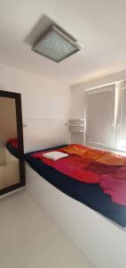 Cama ou camas em um quarto em Apartament Praga ZOO