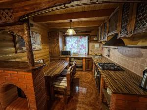 a kitchen with a table and a stove top oven at GorodOk in Migovo