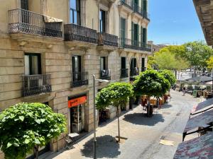 an empty street in front of a building at Som Nit Port Vell in Barcelona