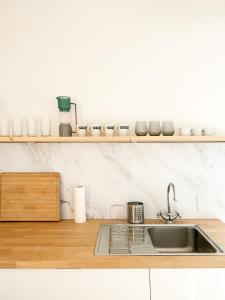 a kitchen with a sink and a counter top at Central Apartment next to Belvedere Castle in Vienna