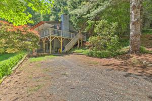 a large house with a porch and a staircase at Boone Hideaway with Deck, Grill and Forest Views! in Boone