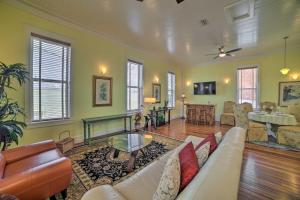 a living room with a couch and a table at Charming DeFuniak Apartment in Historic Dtwn! in DeFuniak Springs