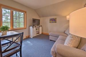 a living room with a couch and a table at Private McCall Apartment with Mountain View! in Donnelly