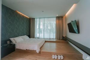 Llit o llits en una habitació de Ohana Resort and Restaurant