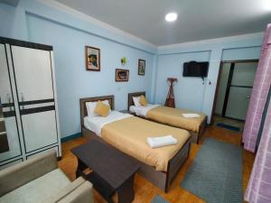 Hotel Pristine客房内的一张或多张床位