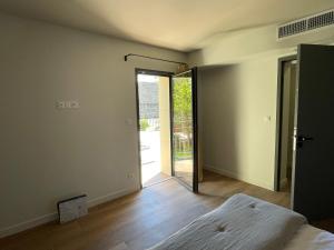 Postel nebo postele na pokoji v ubytování La Maison de l'Olivier