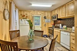 a kitchen with a table with a vase on it at Albrightsville Retreat with Community Pool and Hot Tub in Albrightsville