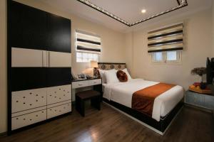 Ένα ή περισσότερα κρεβάτια σε δωμάτιο στο Serenity Diamond Hotel