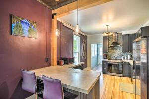 a kitchen with purple chairs and a large wooden island at Pet-Friendly Home with Patio in Downtown Salida in Salida