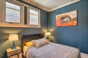 a bedroom with a bed and a painting on the wall at Pet-Friendly Home with Patio in Downtown Salida in Salida