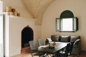 a dining room with a table and chairs at Borgo Valle Rita in Ginosa Marina