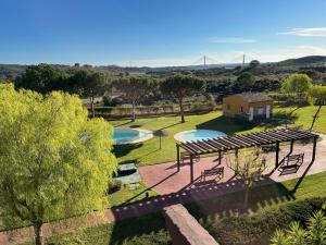 an aerial view of a garden with two pools at Ayamonte - Vista Esuri Golf and Beach in Huelva