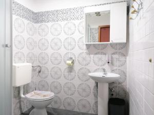 a bathroom with a toilet and a sink at Apartmani Buljubašić in Baška Voda +73 photos