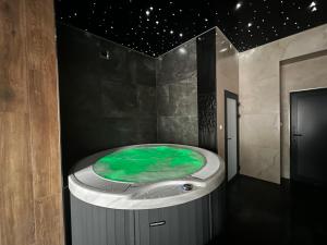 a jacuzzi tub in a room with a star ceiling at WILLA LAZUR in Łeba