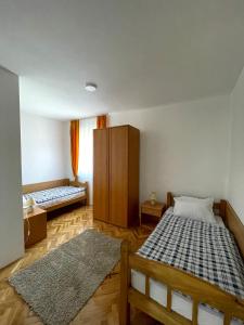 Postel nebo postele na pokoji v ubytování Apartman Venera + 14 fotografií