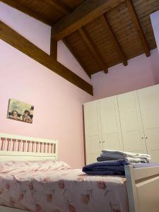 Krevet ili kreveti u jedinici u okviru objekta Casa Mimì
