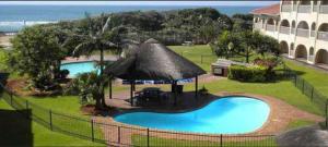 a swimming pool in front of a building at Cabanas Del Mar 31 in Kingsborough