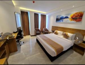Postel nebo postele na pokoji v ubytování Hotel X Rajshahi