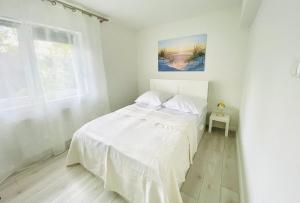 מיטה או מיטות בחדר ב-Villa Park by Baltic Home