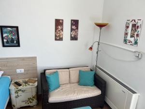 a small room with a chair and a lamp at Apartments Vila Vino in Sveta Nedelja