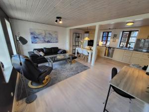 a living room with a couch and a table at City Harbour House in Sønderborg